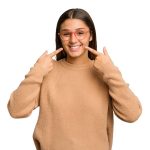 Before and after results of smile correction treatment showing improved teeth alignment and aesthetics