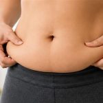 Woman struggling with stubborn body fat despite regular diet and exercise
