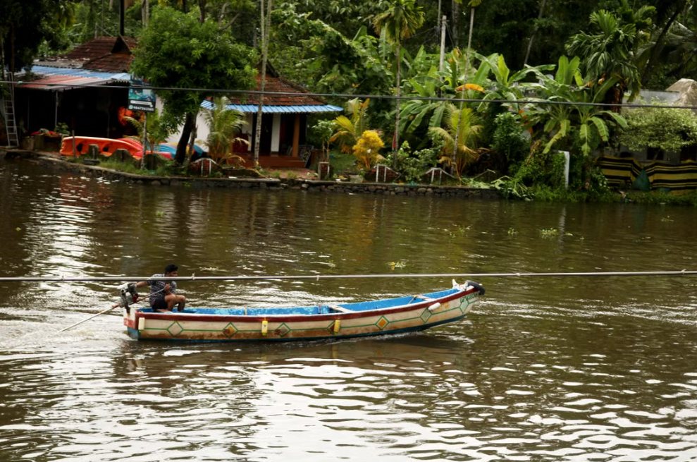 A small country boat on a backwater canal